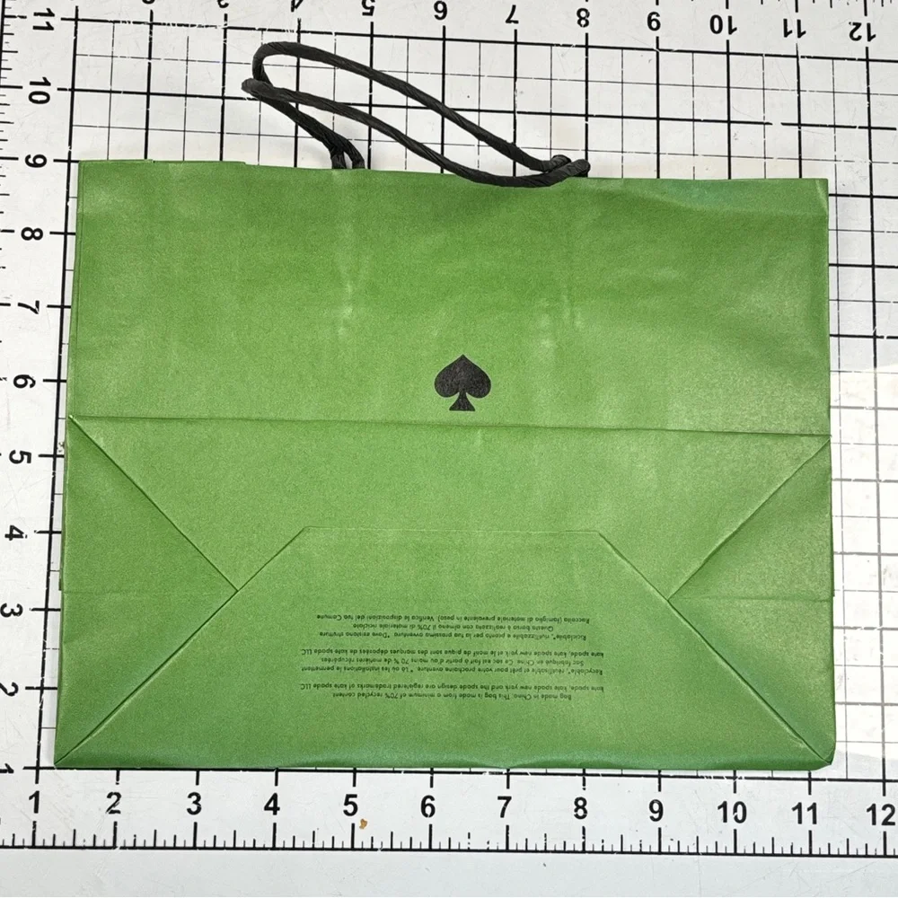 Kate Spade Pink box and green gift bag.